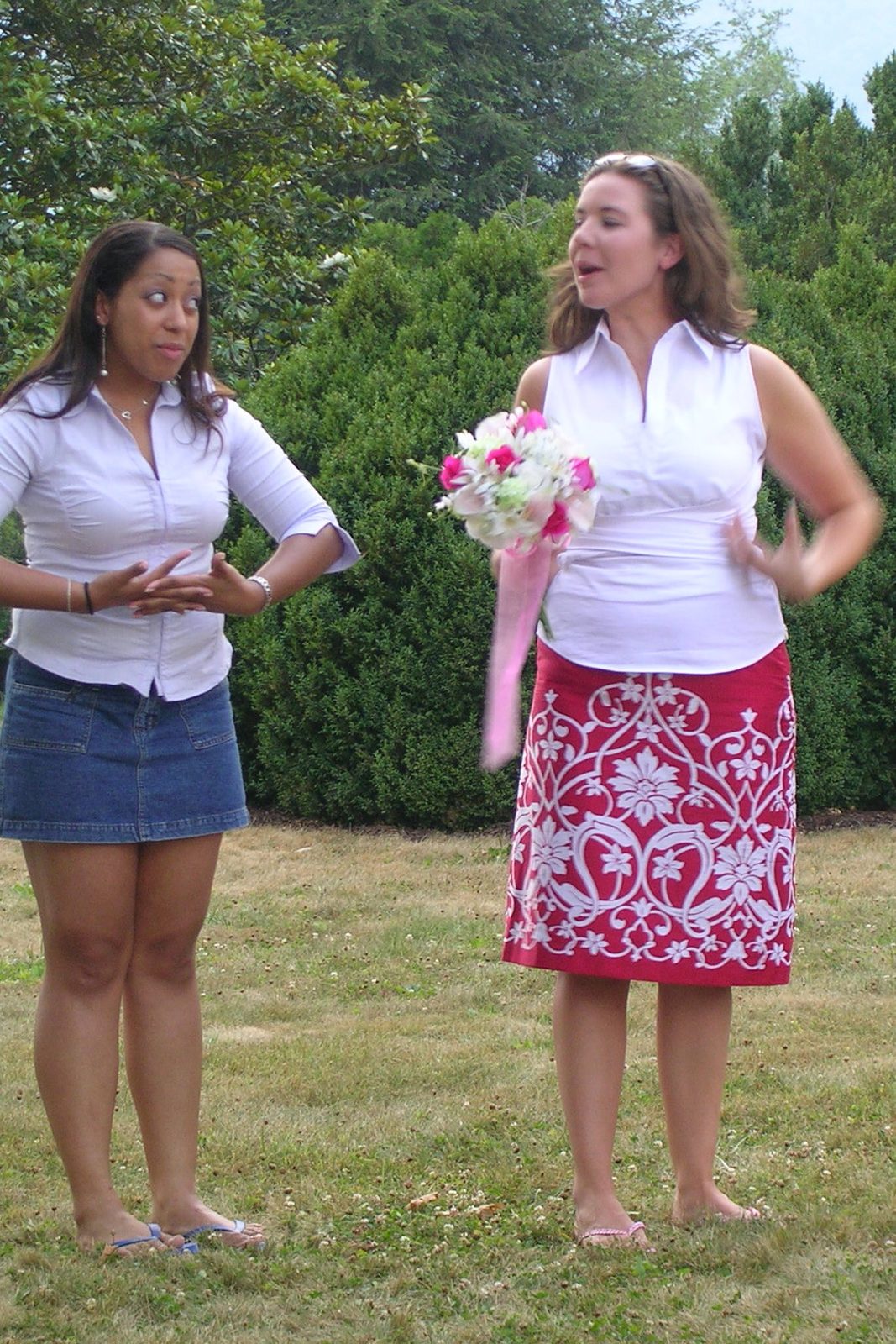 Stef directs the ladies, perhaps on how and where to hold our bouquets.  Tanya is not impressed.